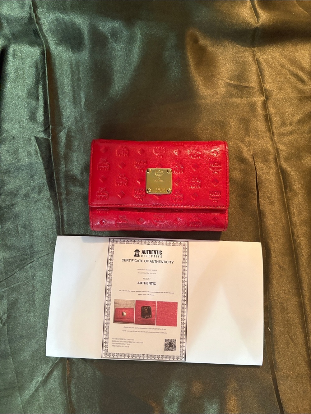 MCM Red Embossed Leather Trifold Wallet with Gold Plaque Accent
